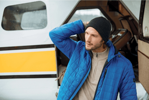 Man wearing Cutter and Buck Rainier PrimaLoft Men's Eco Insulated Full Zip Puffer Jacket