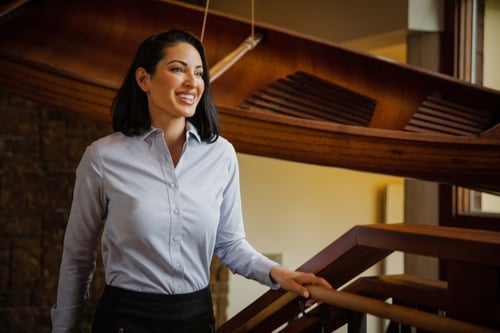 Woman in an office wearing Cutter & Buck Stretch Oxford Stripe Womens Long Sleeve Dress Shirt