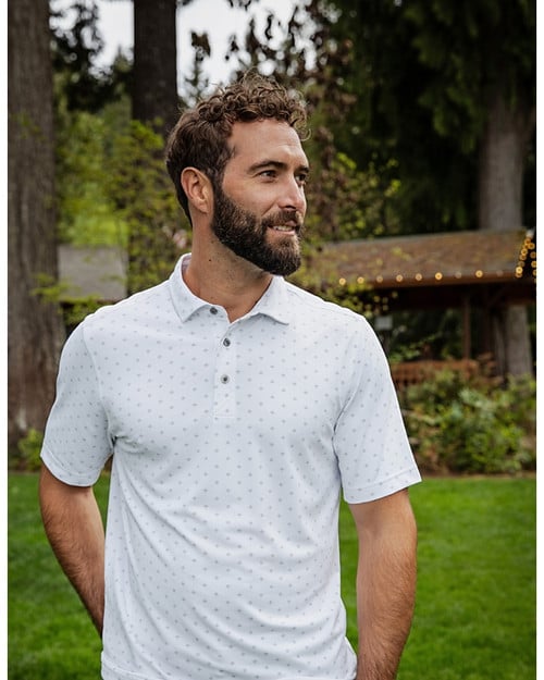 Man outside wearing Cutter & Buck Virtue Eco Pique Tile Print Recycled Mens Polo