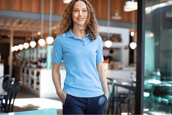 Woman Wearing Cutter & Buck Virtue Eco Pique Recycled Polo