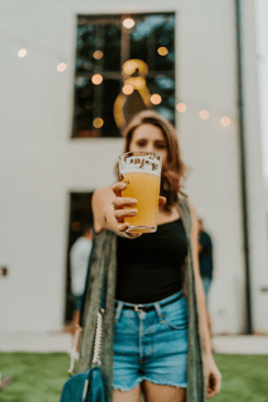 Woman holding a beer
