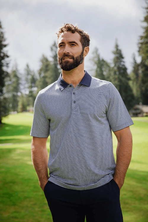 Man on golf course wearing Forge Tonal Stripe Stretch Mens Big and Tall Polo