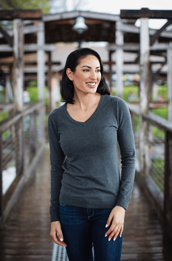 woman walking on bridge outside wearing Cutter & Buck Lakemont Tri-Blend Womens V-Neck Pullover Sweater