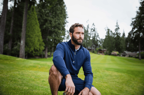 Man on golf course wearing mens pullover