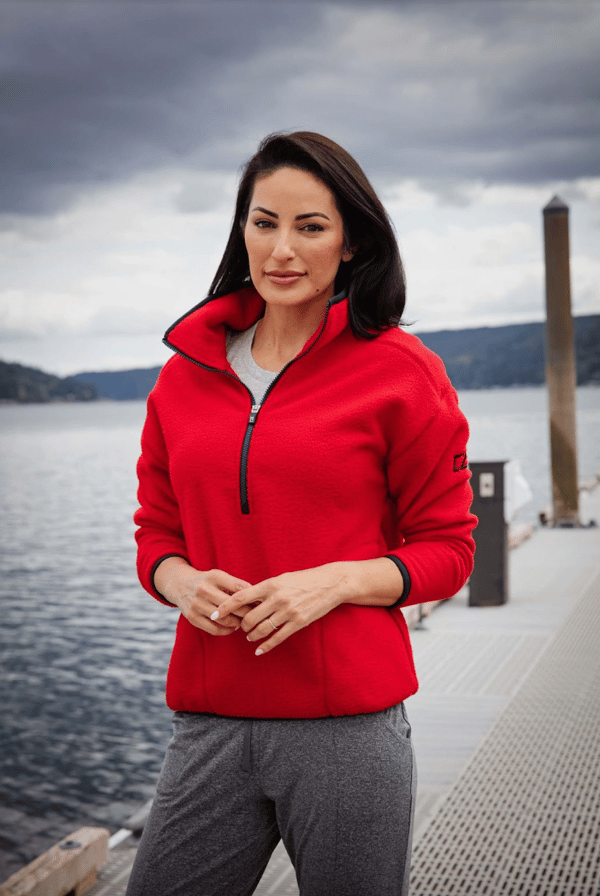 woman outside on dock wearing cutter and buck sherpa pullover