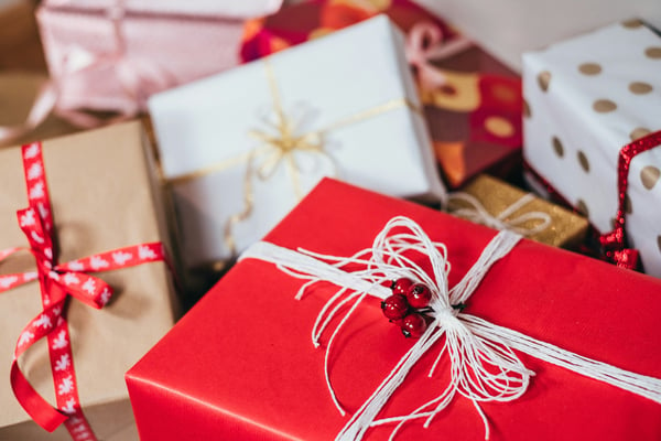 Gifts wrapped in festive paper and ribbons