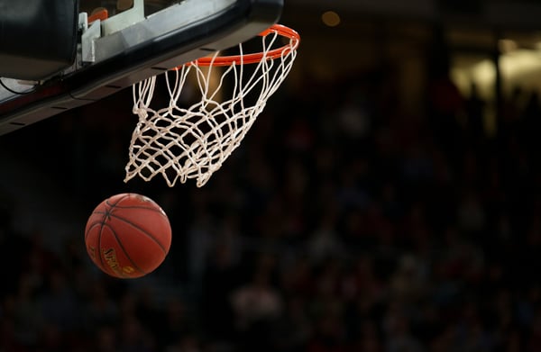 A basketball that has gone through the hoop