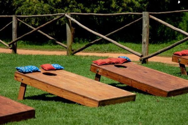 Cornhole game set up in a yard